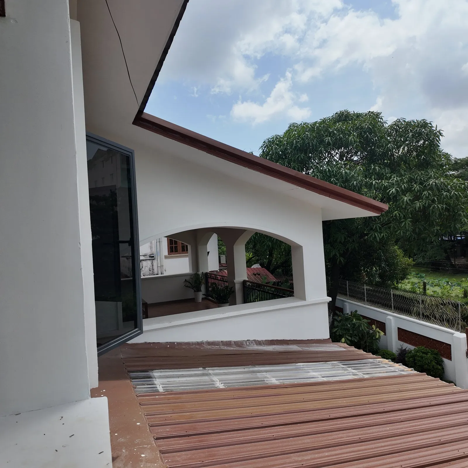 A finished two-storey house with a covered veranda, built by K Empire in Yangon
